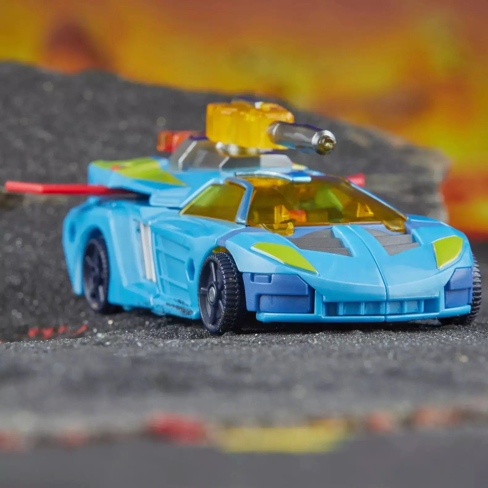 Transformers Legacy United Deluxe Class Cybertron Universe Hot Shot action figure posed with detailed robot features.