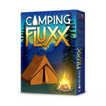 Camping Fluxx board game by THE MIGHTY HOBBY SHOP featuring colorful cards and playful game components on a wooden table.