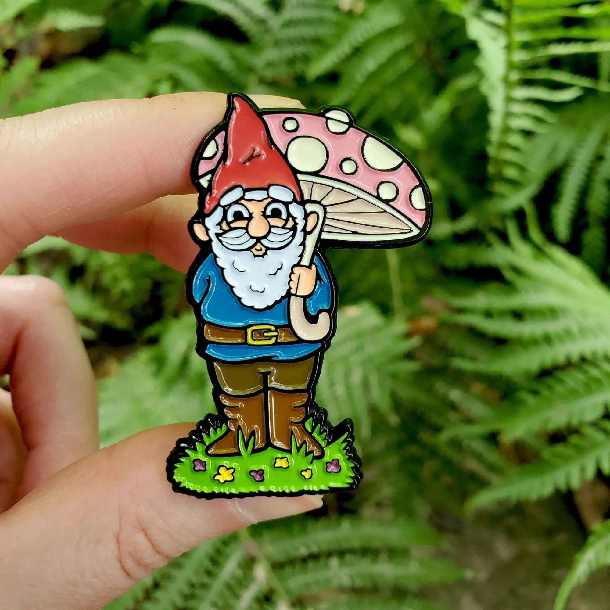 Kolorspun garden gnome enamel pin with fern design, featuring colorful gnome character and detailed fern accents.