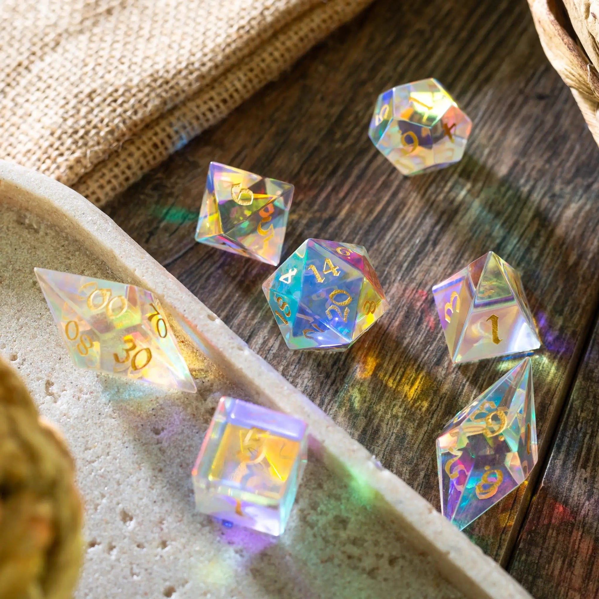 Set of gemstone dichroic glass Elven cut DND dice from Runic Dice, featuring vibrant, colorful, and intricate gemstone patterns.