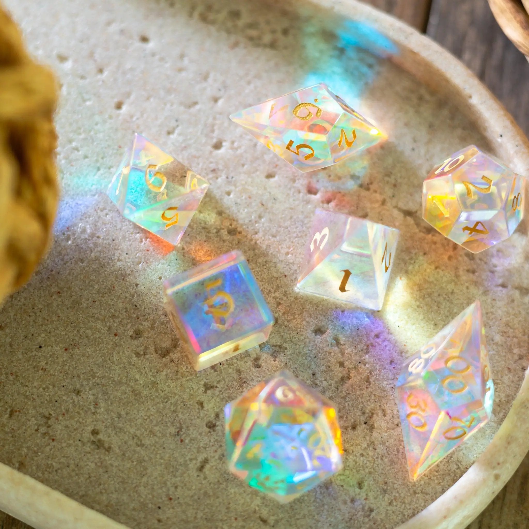Runic Dice gemstone dichroic glass Elven cut D&D dice set, featuring vibrant, colorful gemstone dice with intricate Elven design.