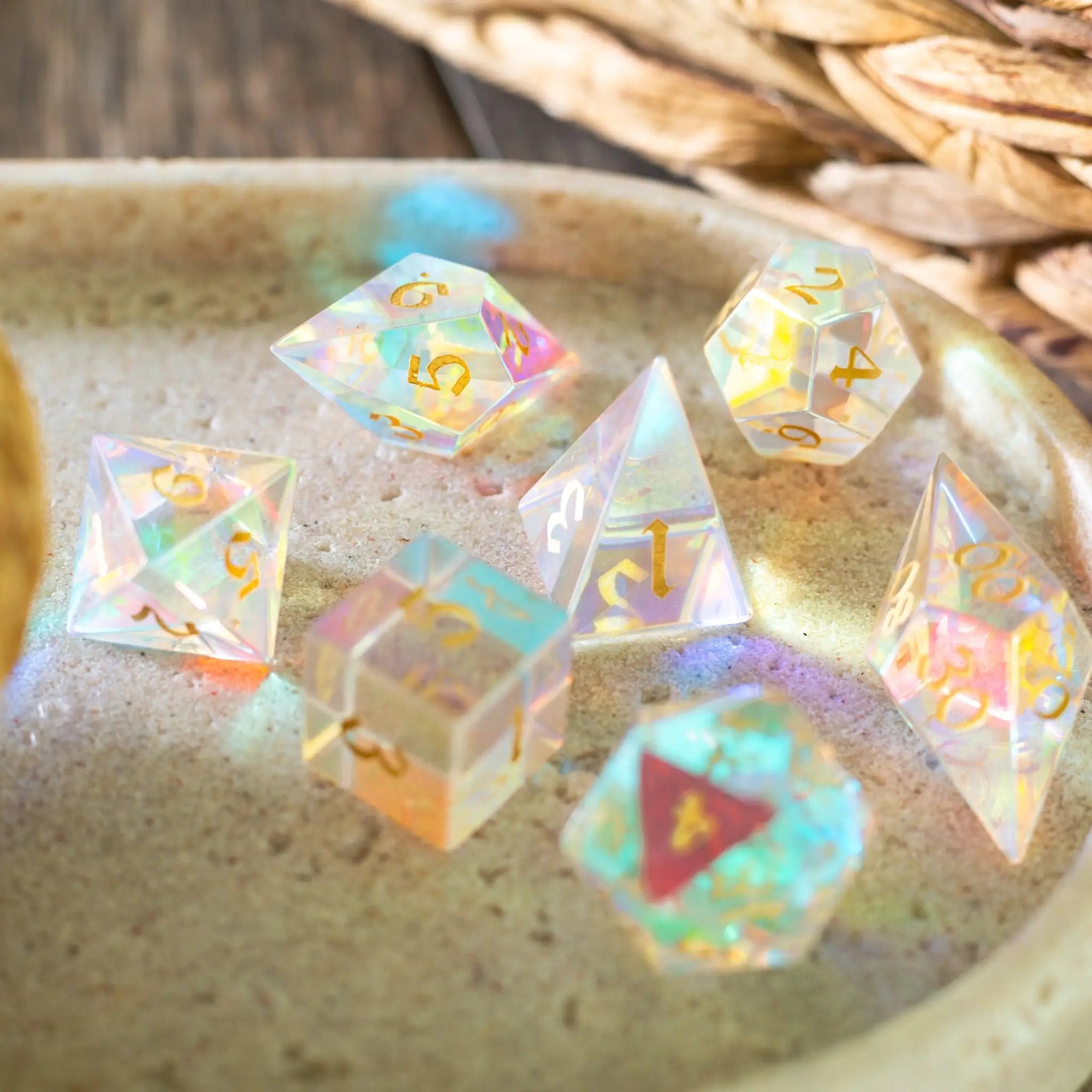 Set of gemstone dichroic glass Elven cut DND dice from Runic Dice, showcasing vibrant colors and intricate geometric patterns.