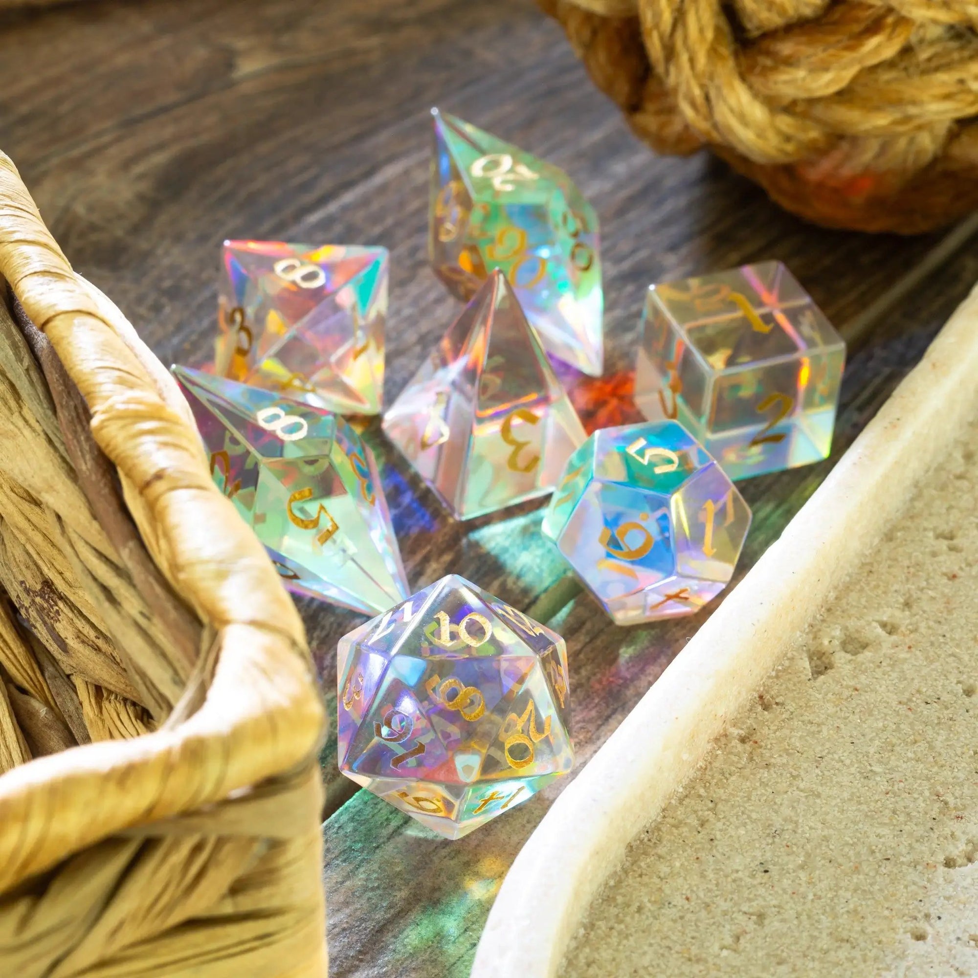 Set of gemstone dichroic glass Elven cut DND dice by Runic Dice, featuring vibrant, shimmering colors and intricate designs.