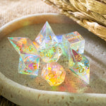 Set of gemstone dichroic glass Elven cut DND dice from Runic Dice, featuring vibrant colors and intricate designs.