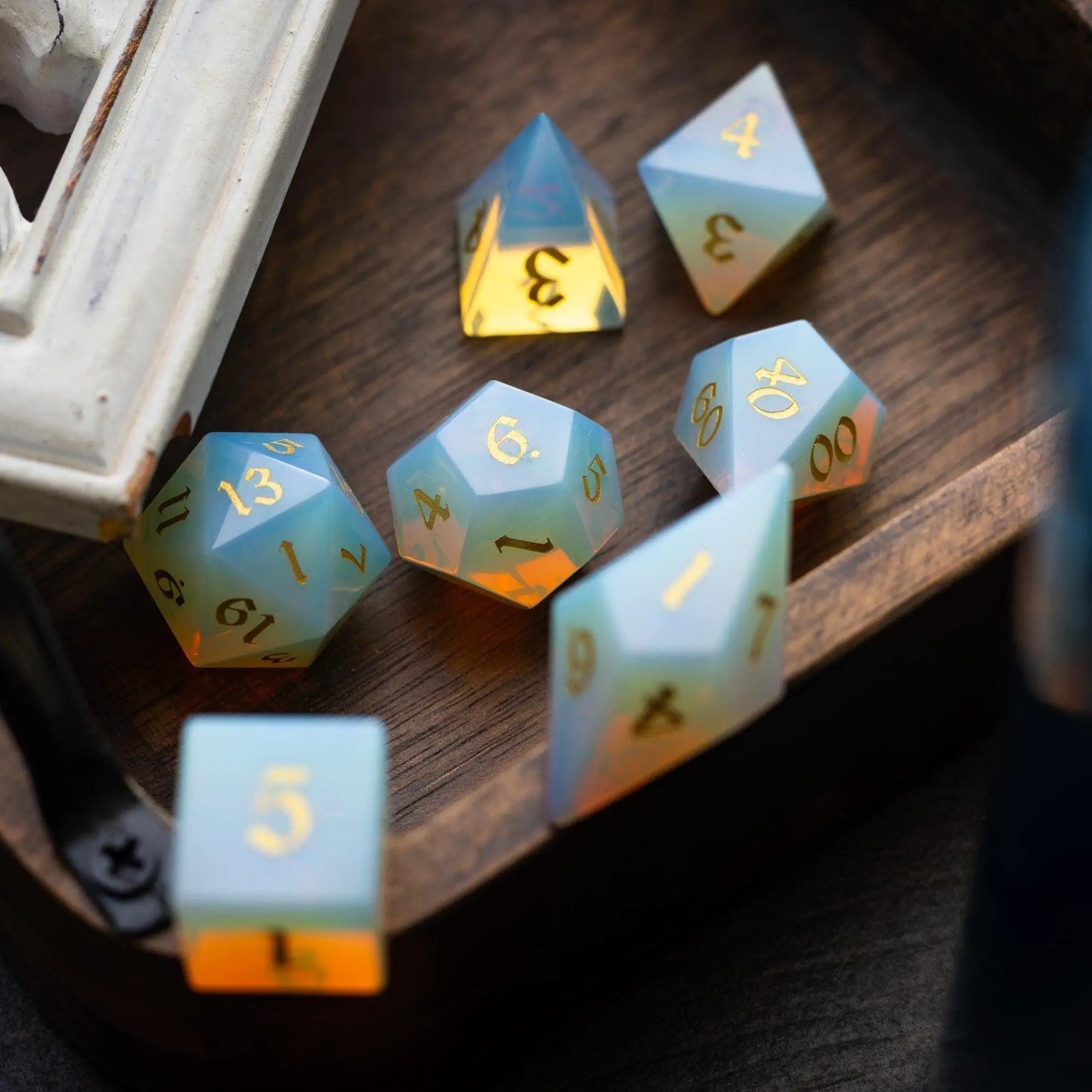 Set of gemstone Opalite Elven Cut DND dice from Runic Dice, featuring colorful, faceted gemstone dice for tabletop gaming.