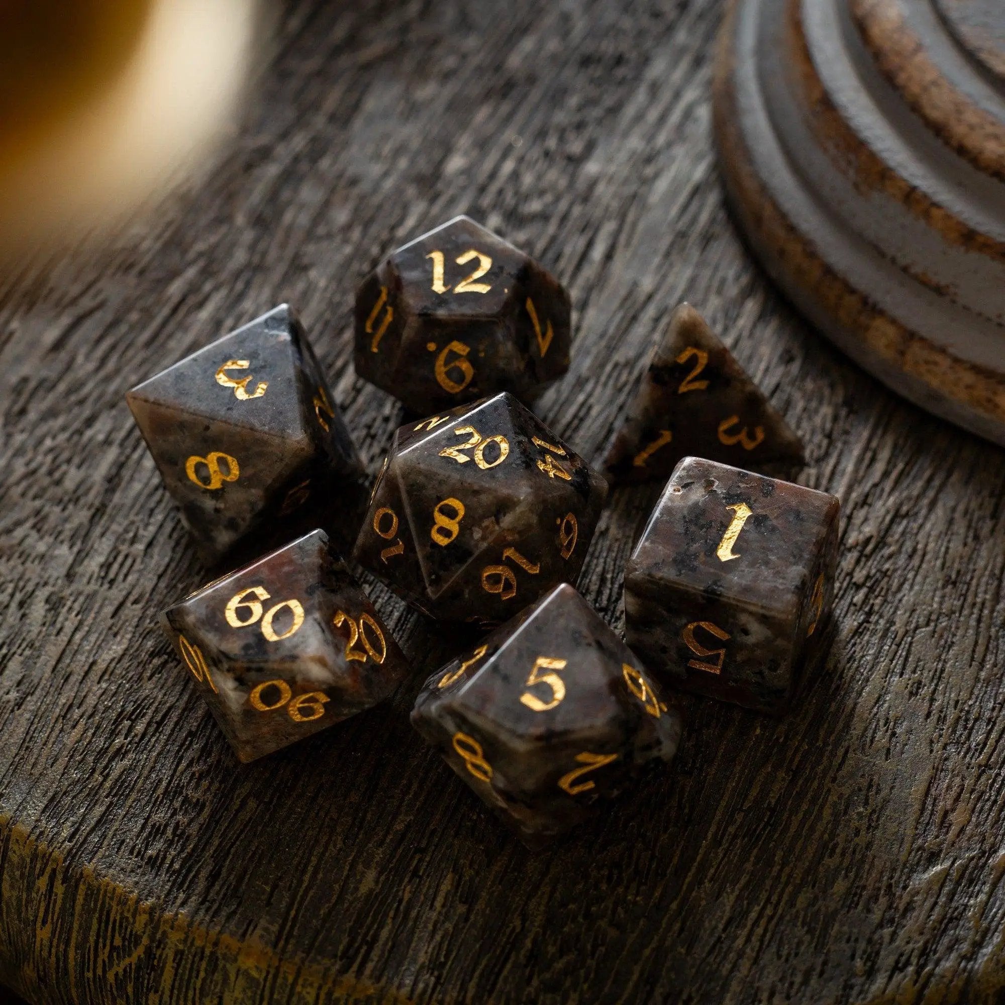 Hand-carved Yooperlite gemstone DND dice set by Runic Dice, featuring vibrant, polished gemstone dice for tabletop gaming.