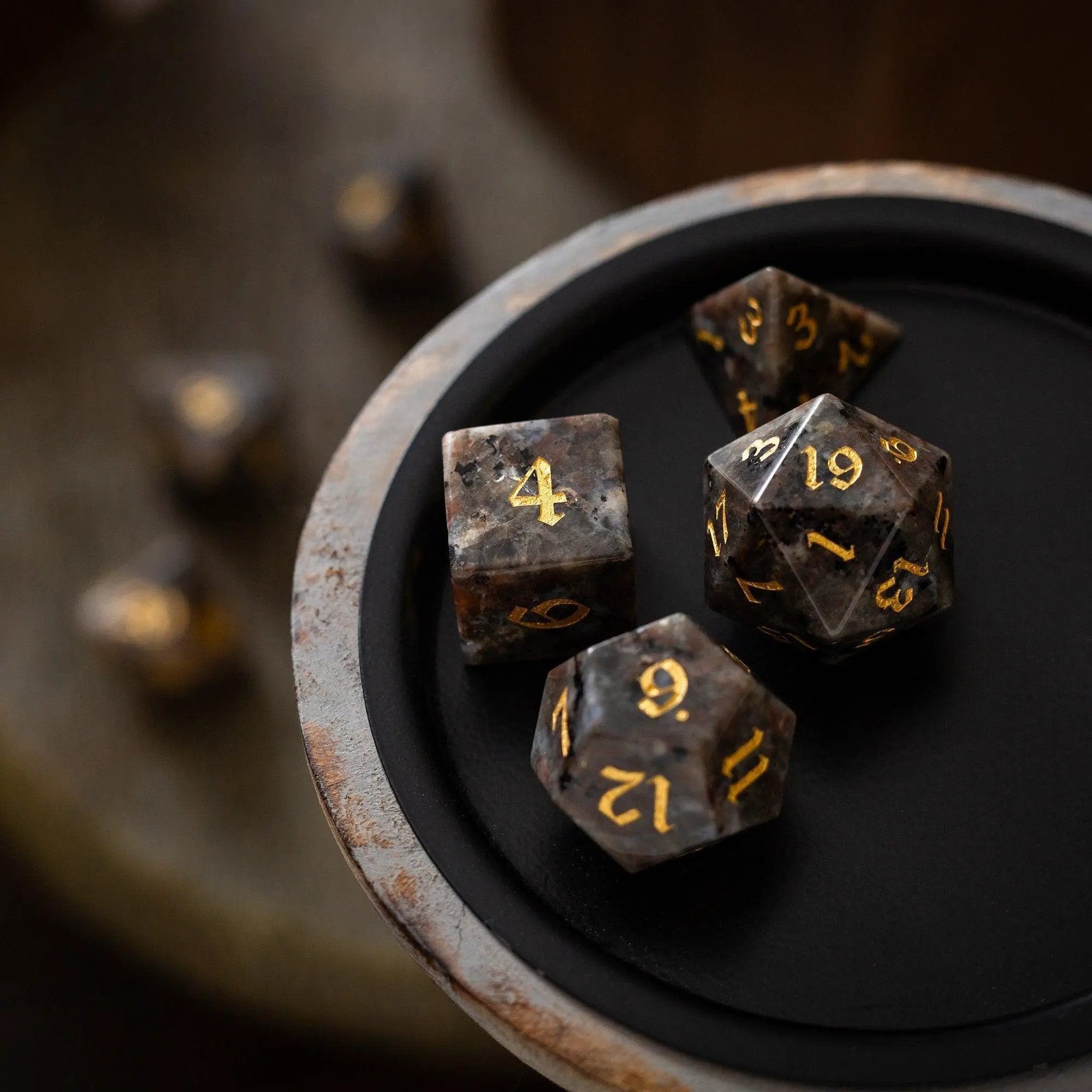 Hand-carved Yooperlite gemstone DND dice set by Runic Dice, featuring vibrant, polished gemstone dice for tabletop gaming.