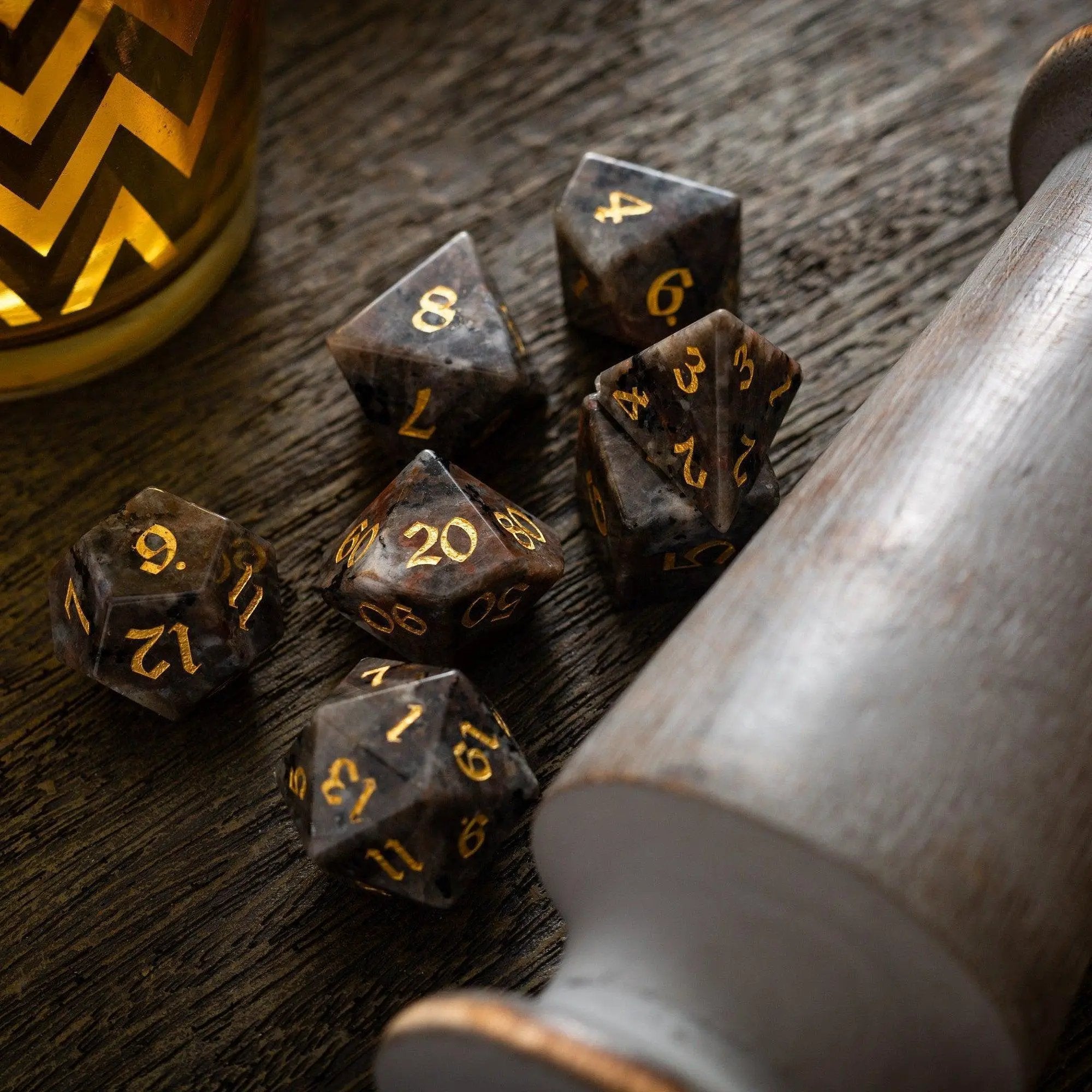 Hand-carved Yooperlite gemstone DND dice set by Runic Dice featuring six colorful, polished gemstone dice for tabletop gaming.