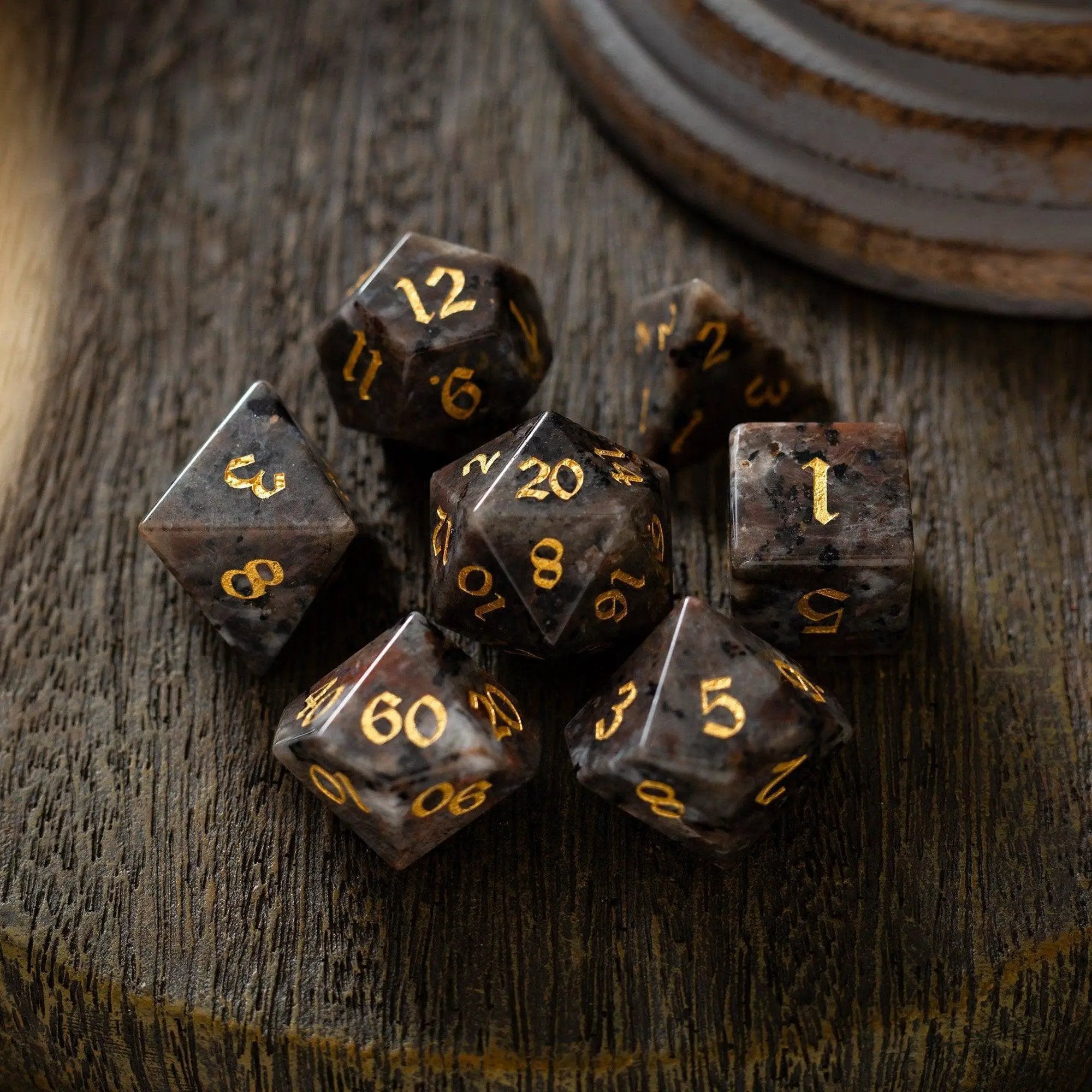 Hand-carved Yooperlite gemstone DND dice set by Runic Dice, featuring vibrant, polished gemstone dice for tabletop gaming.