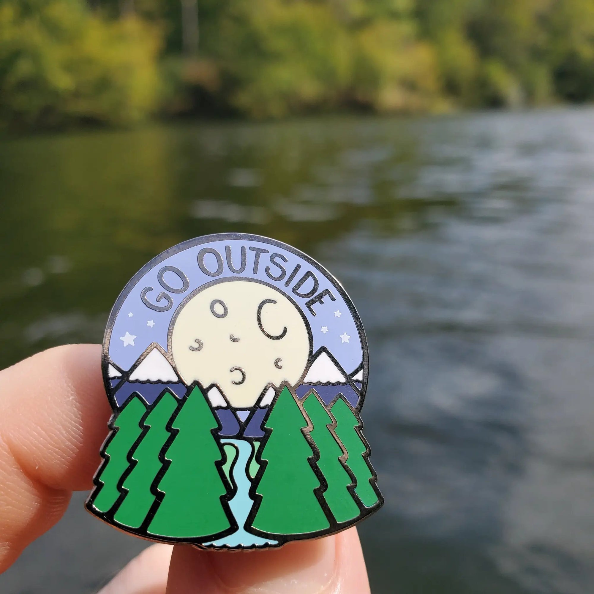 Kolorspun Go Outside pin featuring a water-themed design, perfect for outdoor enthusiasts and pin collectors.