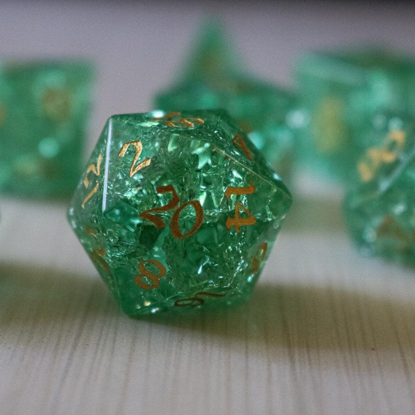 Green lightning cracked glass gemstone DND dice set by Runic Dice, featuring vibrant green and crackled design for tabletop gaming.