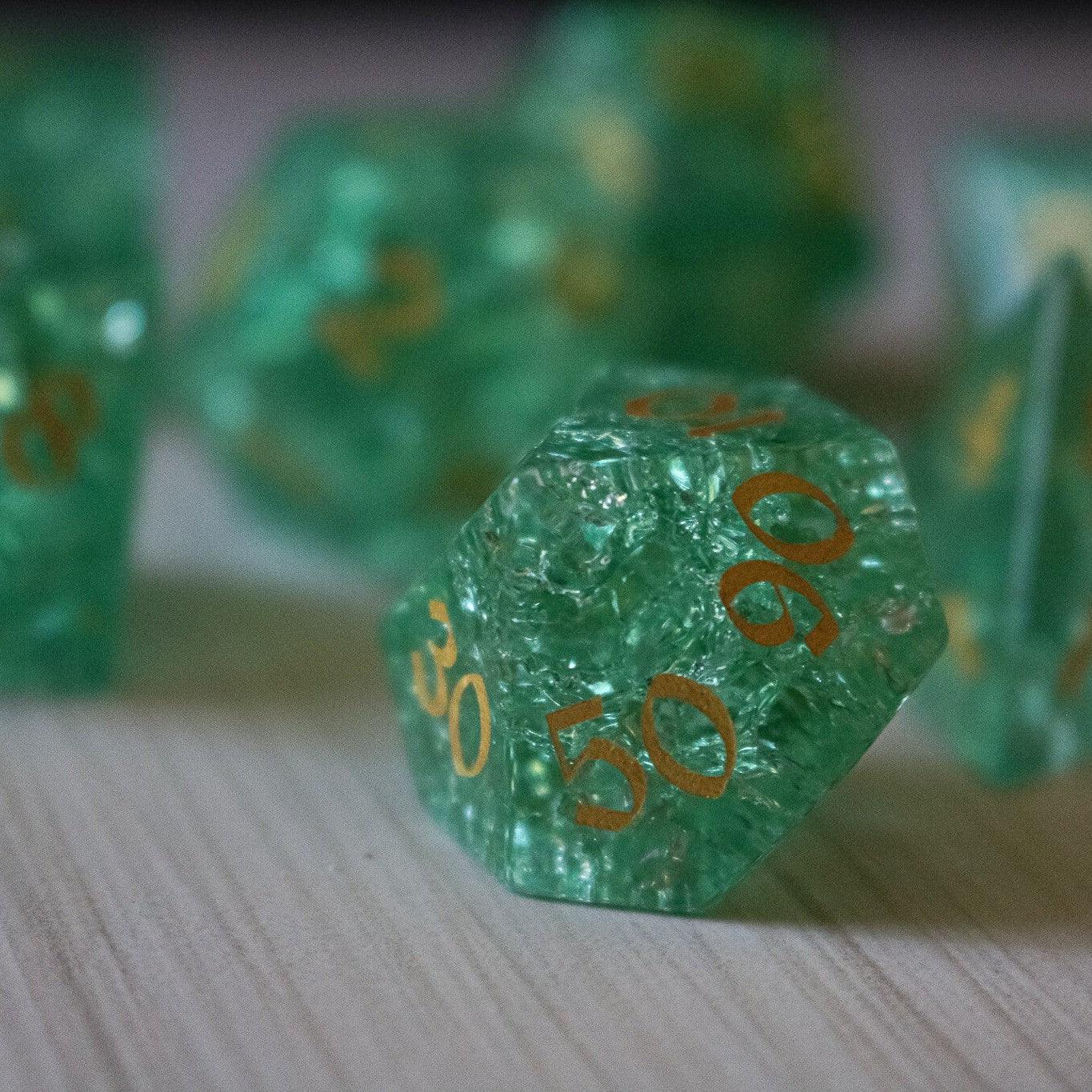 Green lightning cracked glass gemstone DND dice set by Runic Dice, featuring vibrant green and crackled glass design.