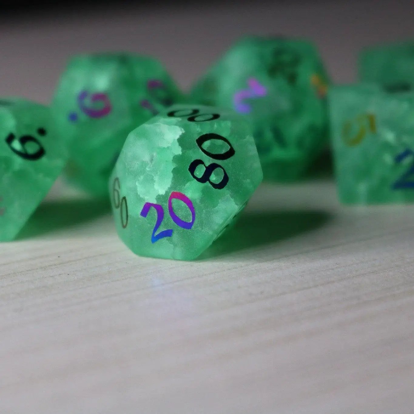 Green mint inked lightning cracked glass DND gemstone dice set by Runic Dice featuring vibrant, detailed fantasy-style gaming dice.