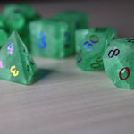 Green mint gemstone DND dice set with inked lightning crack design by Runic Dice, featuring cracked glass texture for tabletop gaming.