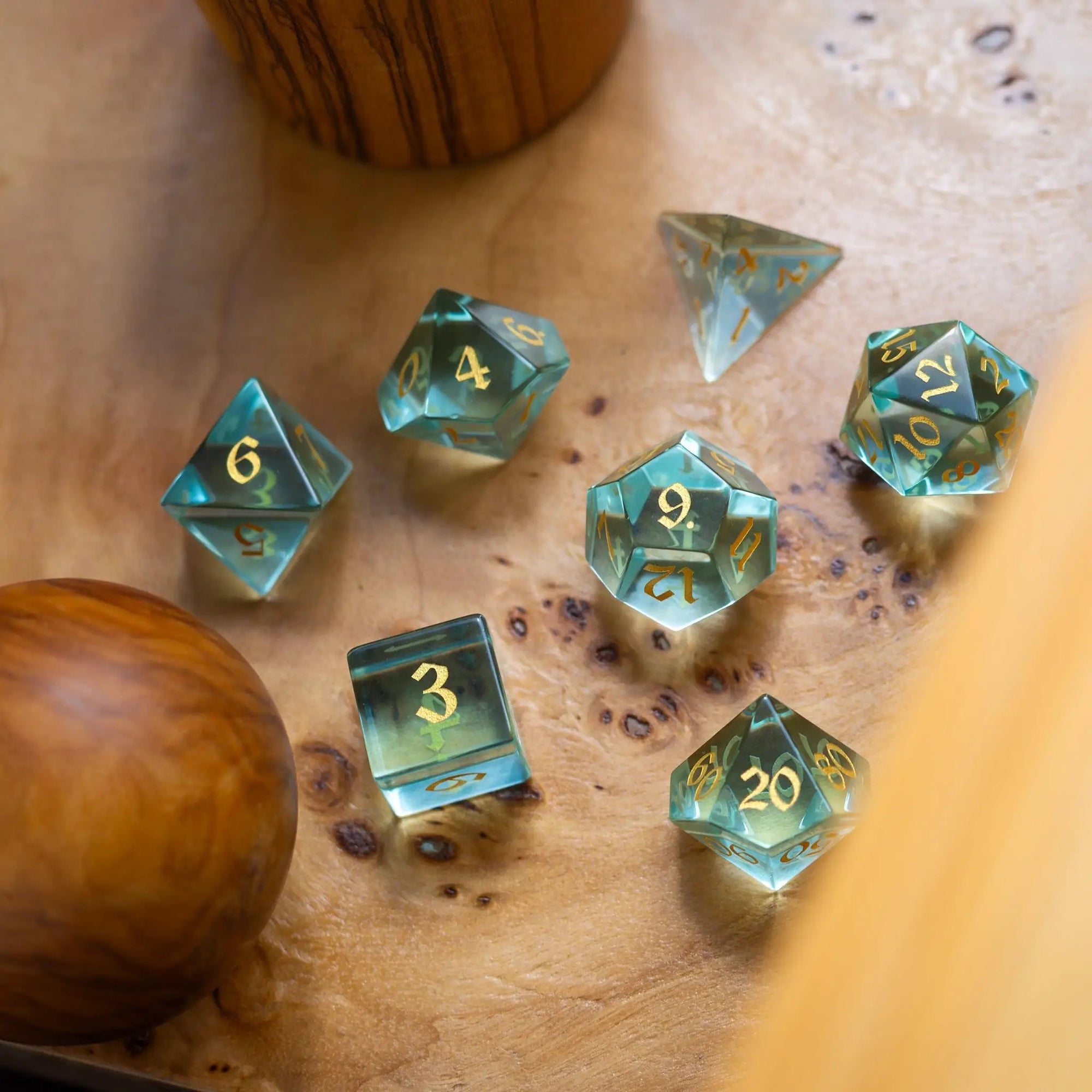 Green water glass gemstone DND dice set with hand-carved symbols from Runic Dice, featuring vibrant green hues and intricate details.
