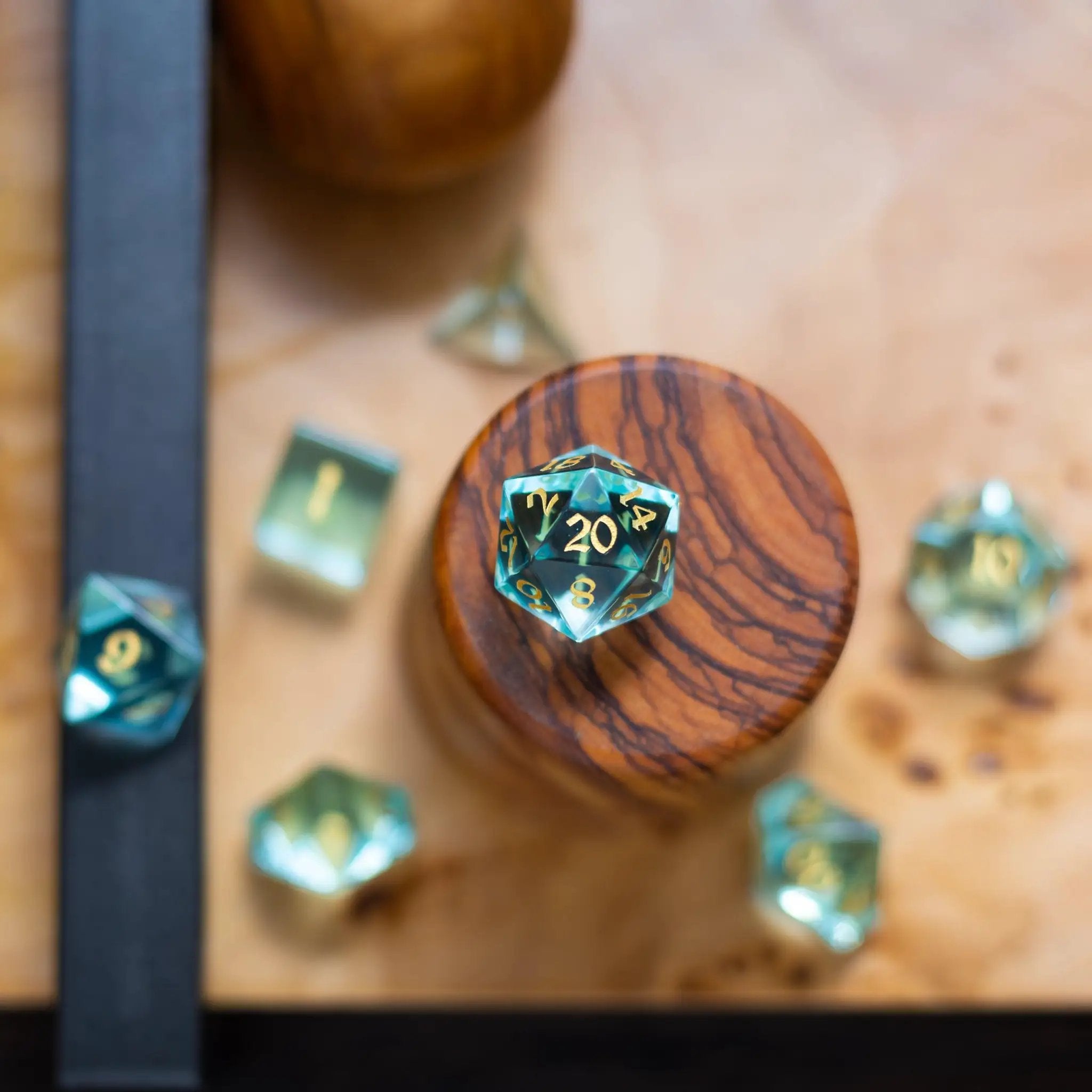 Hand-carved green water glass gemstone DND dice set by Runic Dice featuring intricately carved gaming dice for tabletop role-playing games.