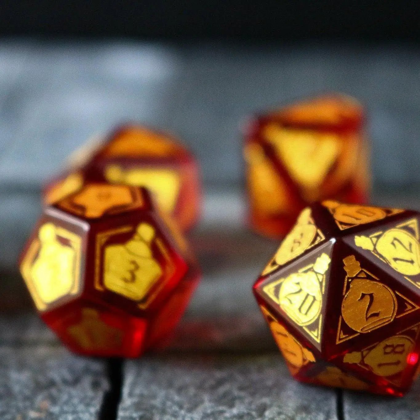 Red zircon gemstone dice set by Runic Dice featuring a health potion design for D&D gaming.