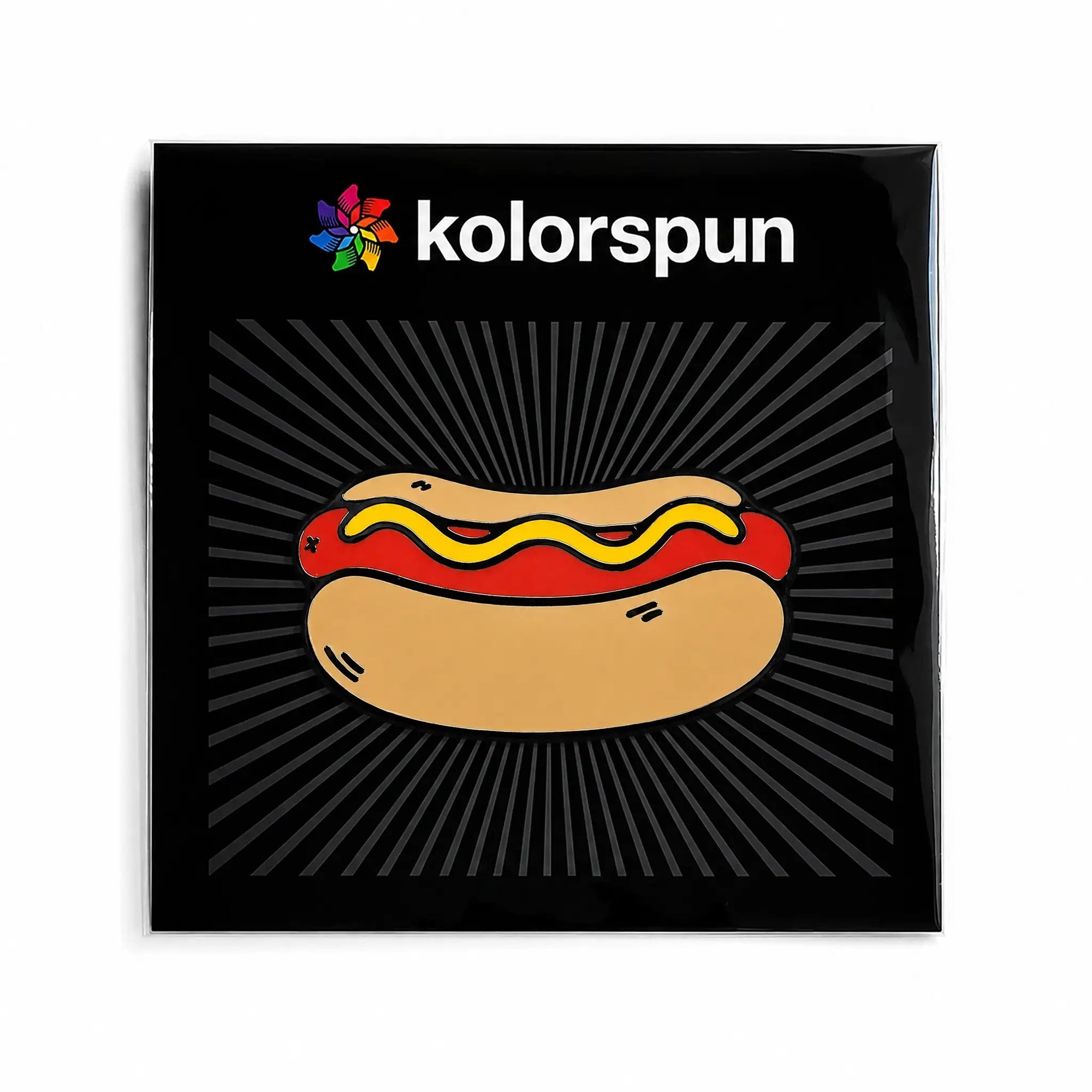 Kolorspun Hot Dog golf ball marker attached to a card, featuring a fun hot dog design for marking golf balls on the course.