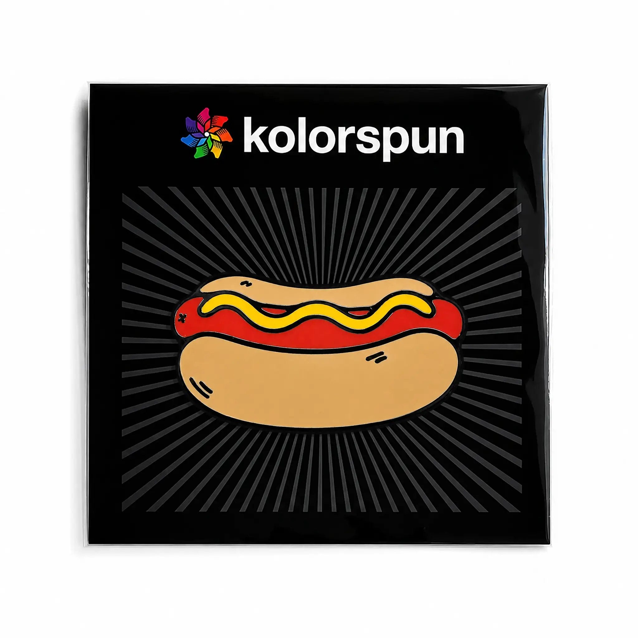Kolorspun Hot Dog golf ball marker attached to a card, featuring a fun hot dog design for marking golf balls on the course.