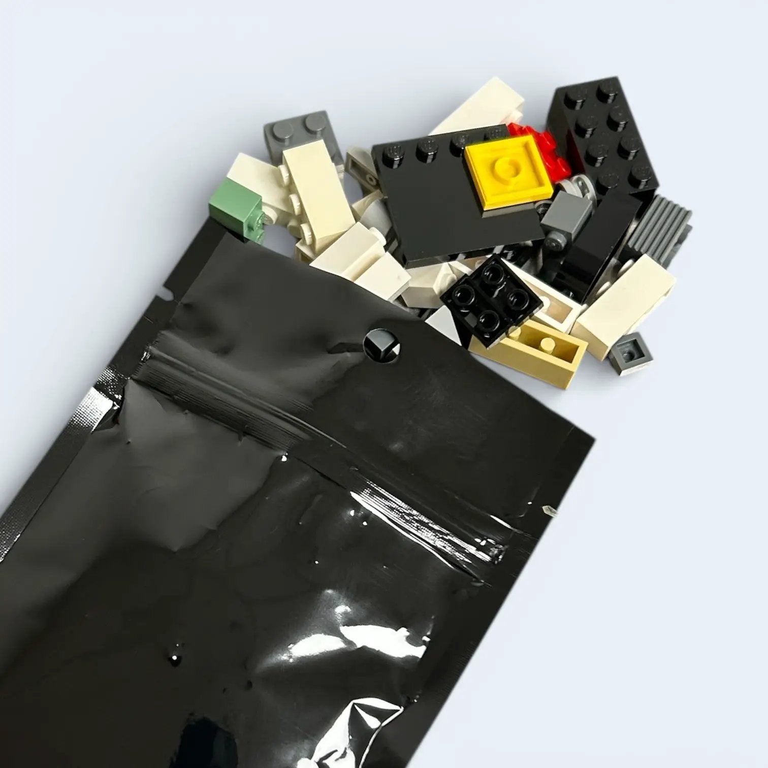 Assorted LEGO parts from B3 Customs' GWP pack, including various bricks and pieces for creative building projects.