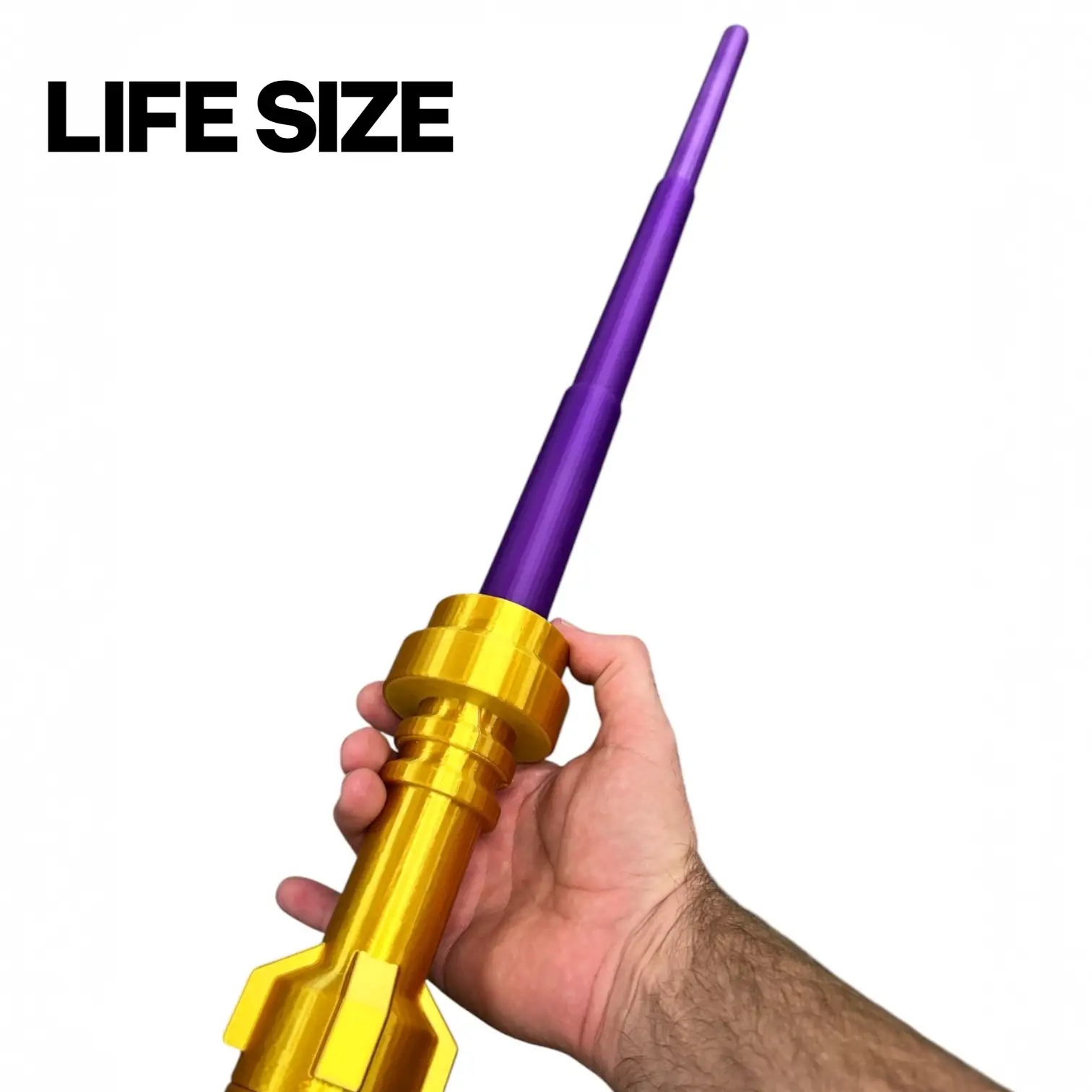 Life-size Royal Fusion Brick Blade by B3 Customs with gold finish and retractable purple blade, detailed close-up view.