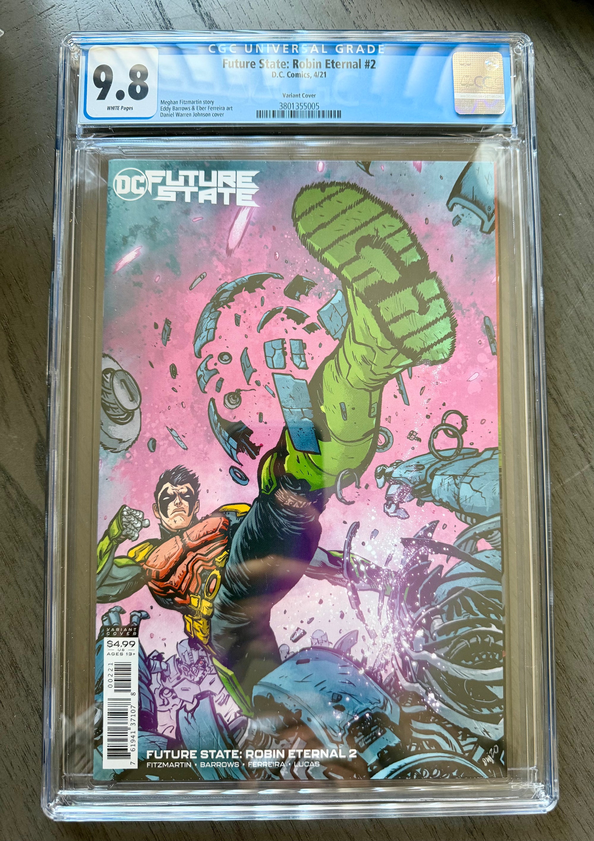 Comic book in a clear plastic cover with a grading label on a wooden surface