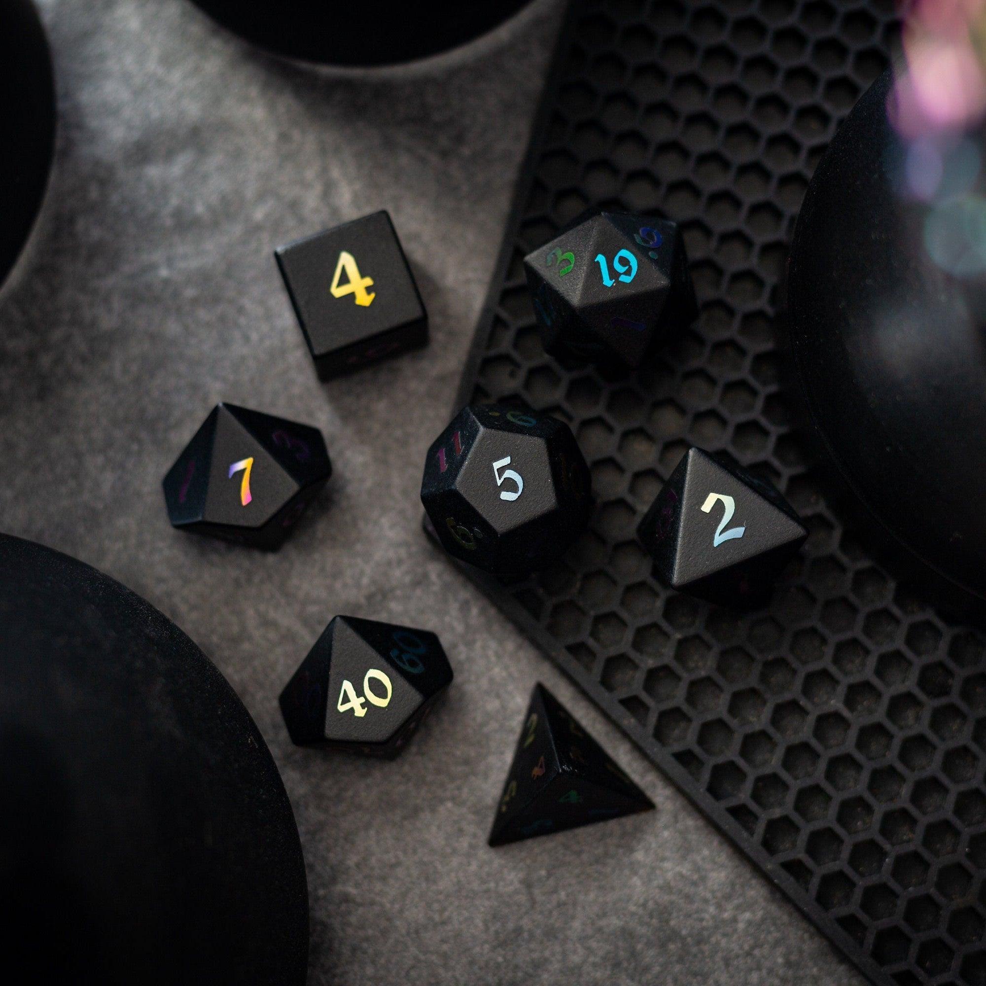 Set of Inked Black Night raised obsidian gemstone dice for D&D, hand-carved with intricate details, by Runic Dice.