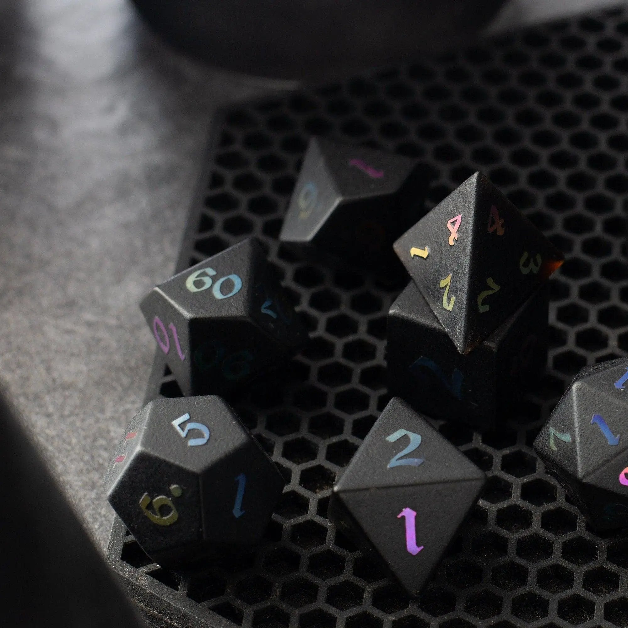 Runic Dice Inked Black Night raised obsidian gemstone dice set with hand-carved DND-themed designs on each die.