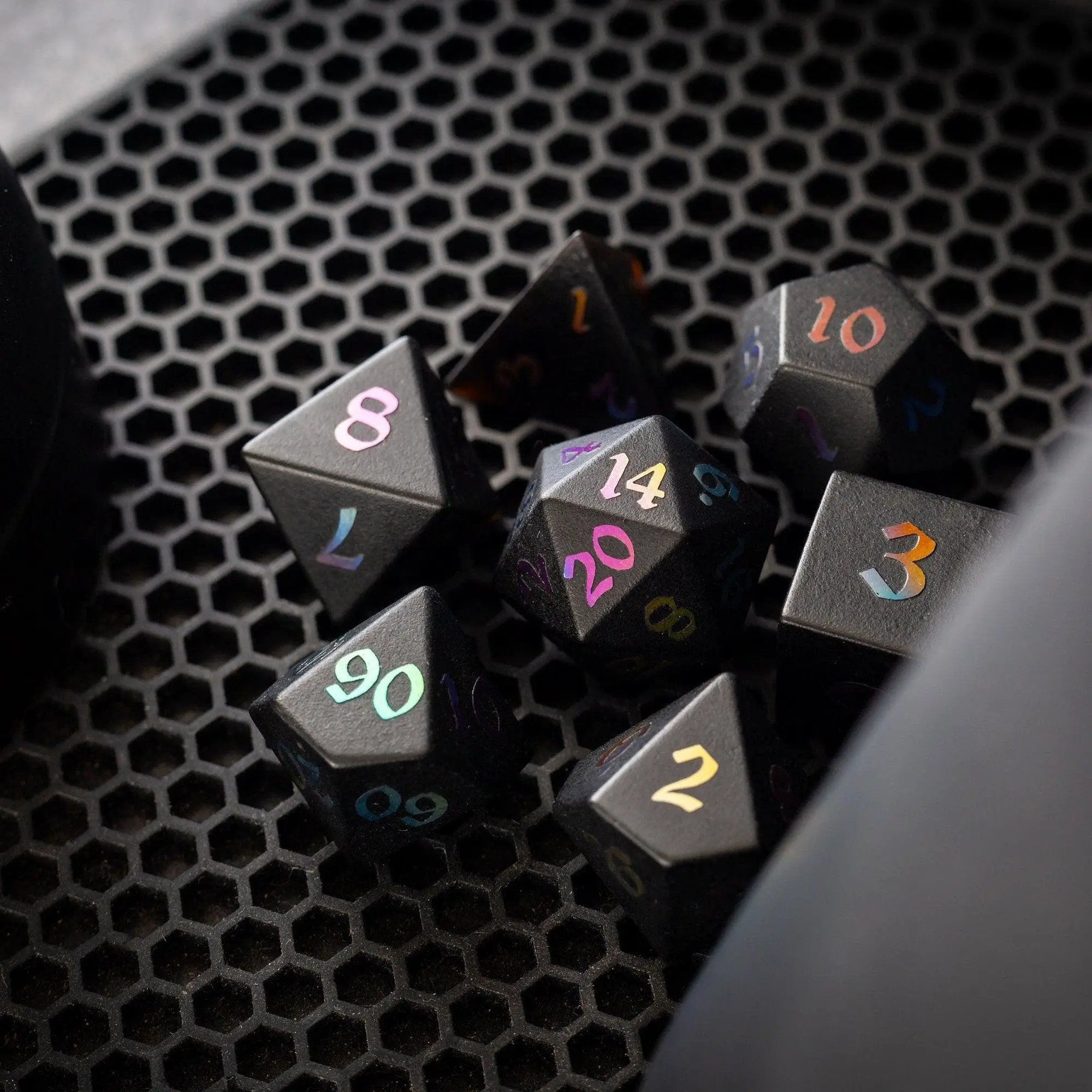 Set of Inked Black Night raised obsidian gemstone dice, hand-carved D&D dice set by Runic Dice with detailed engravings.