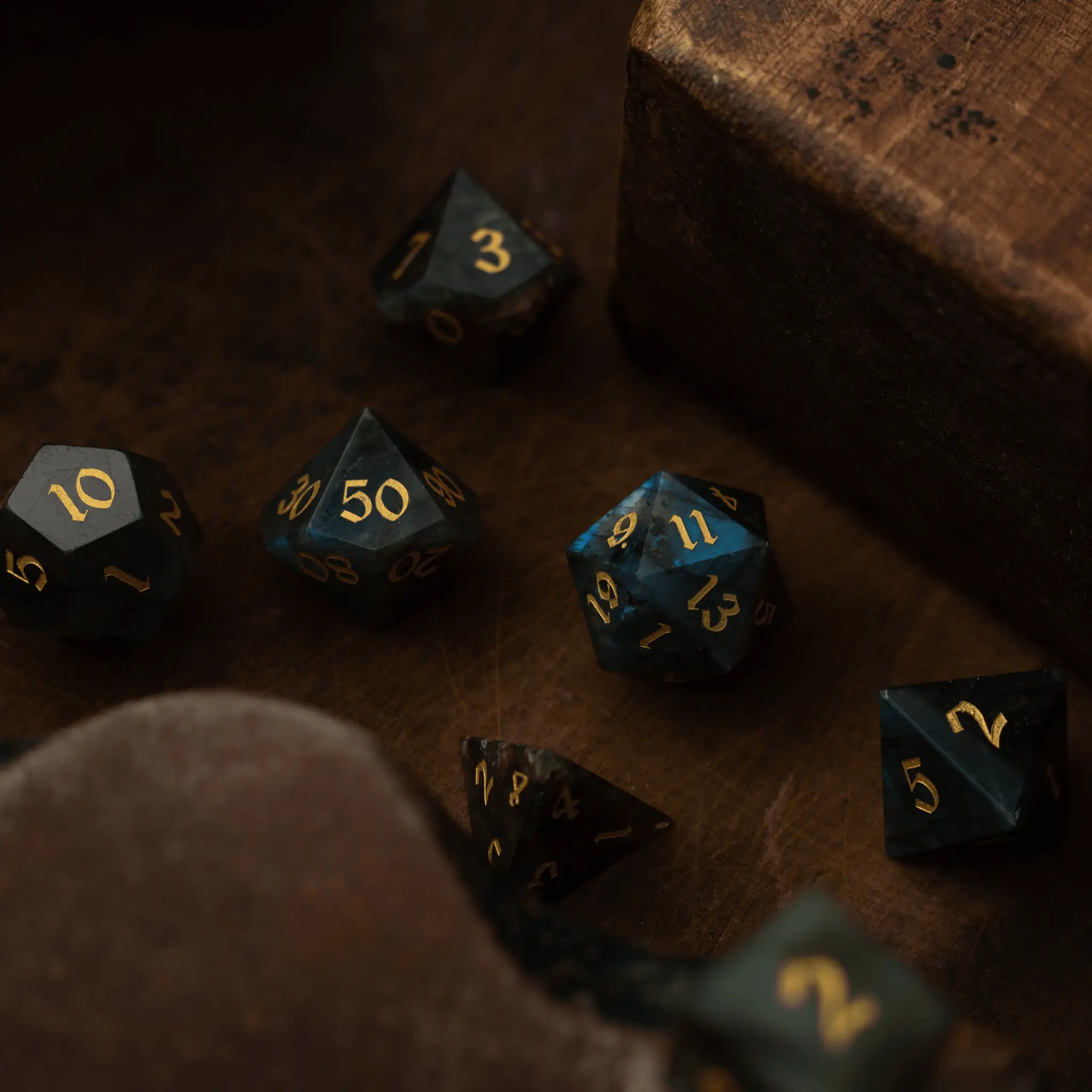 Labradorite gemstone DND dice set from Runic Dice with iridescent, polished gemstone surfaces and detailed numbering.