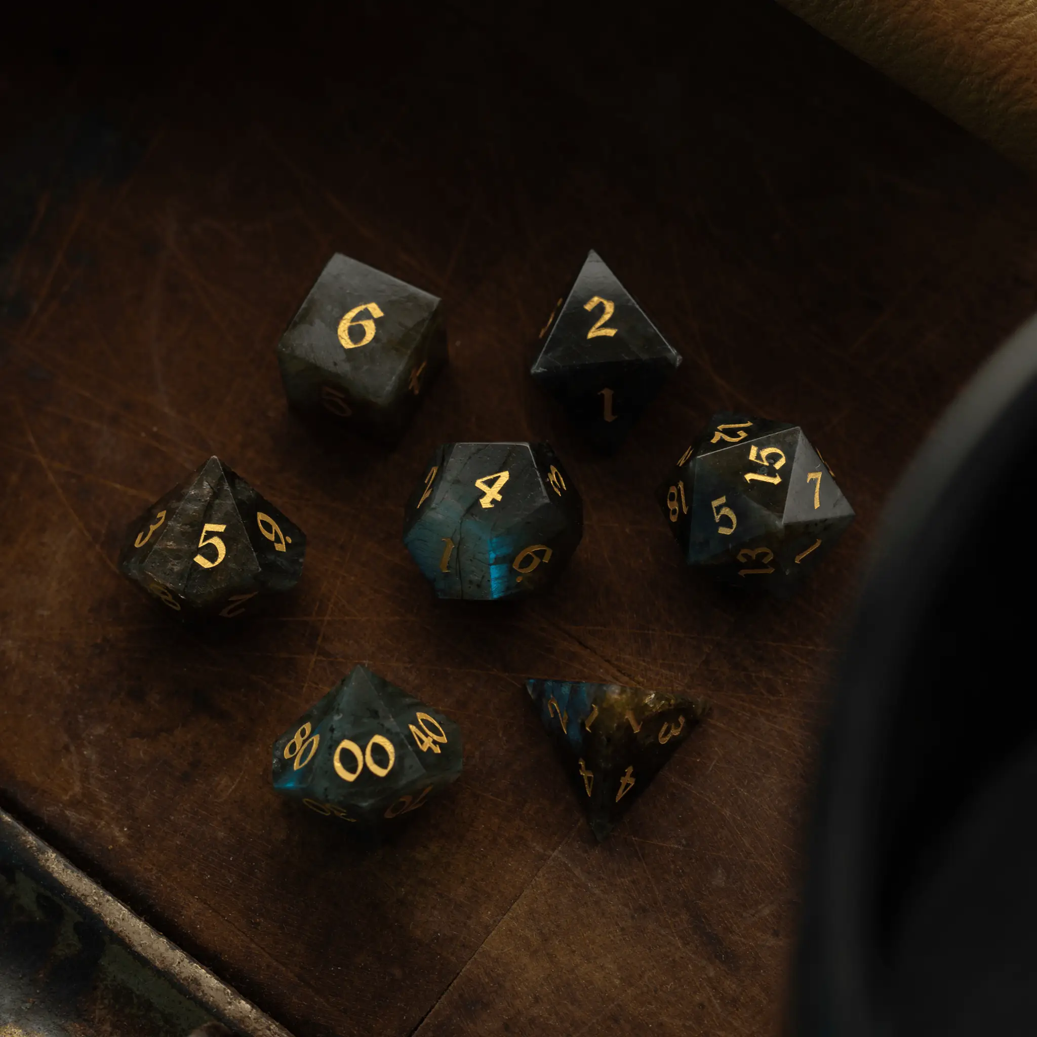 Labradorite gemstone DND dice set by Runic Dice featuring polished, multicolored gemstone six-sided dice for tabletop gaming.