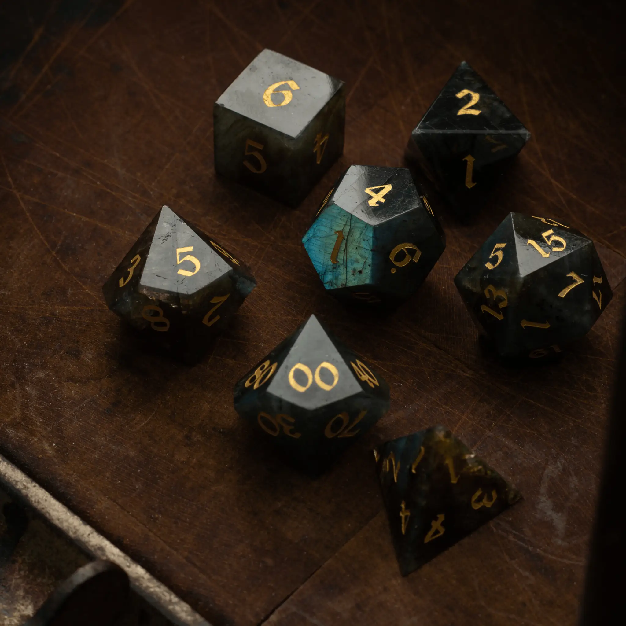 Labradorite gemstone DND dice set by Runic Dice, featuring six polished gemstone dice with vibrant labradorite flash effects.