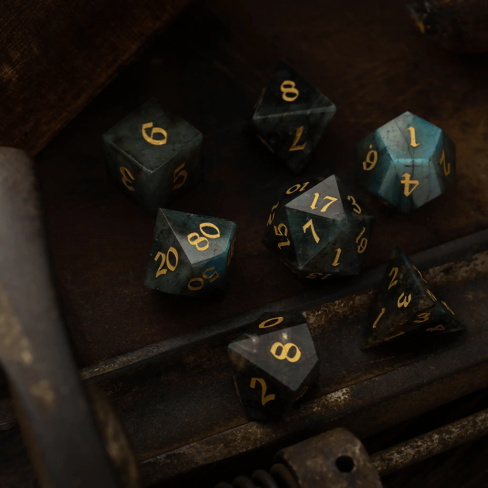 Labradorite gemstone DND dice set by Runic Dice, featuring polished gemstone polyhedral dice for tabletop gaming.