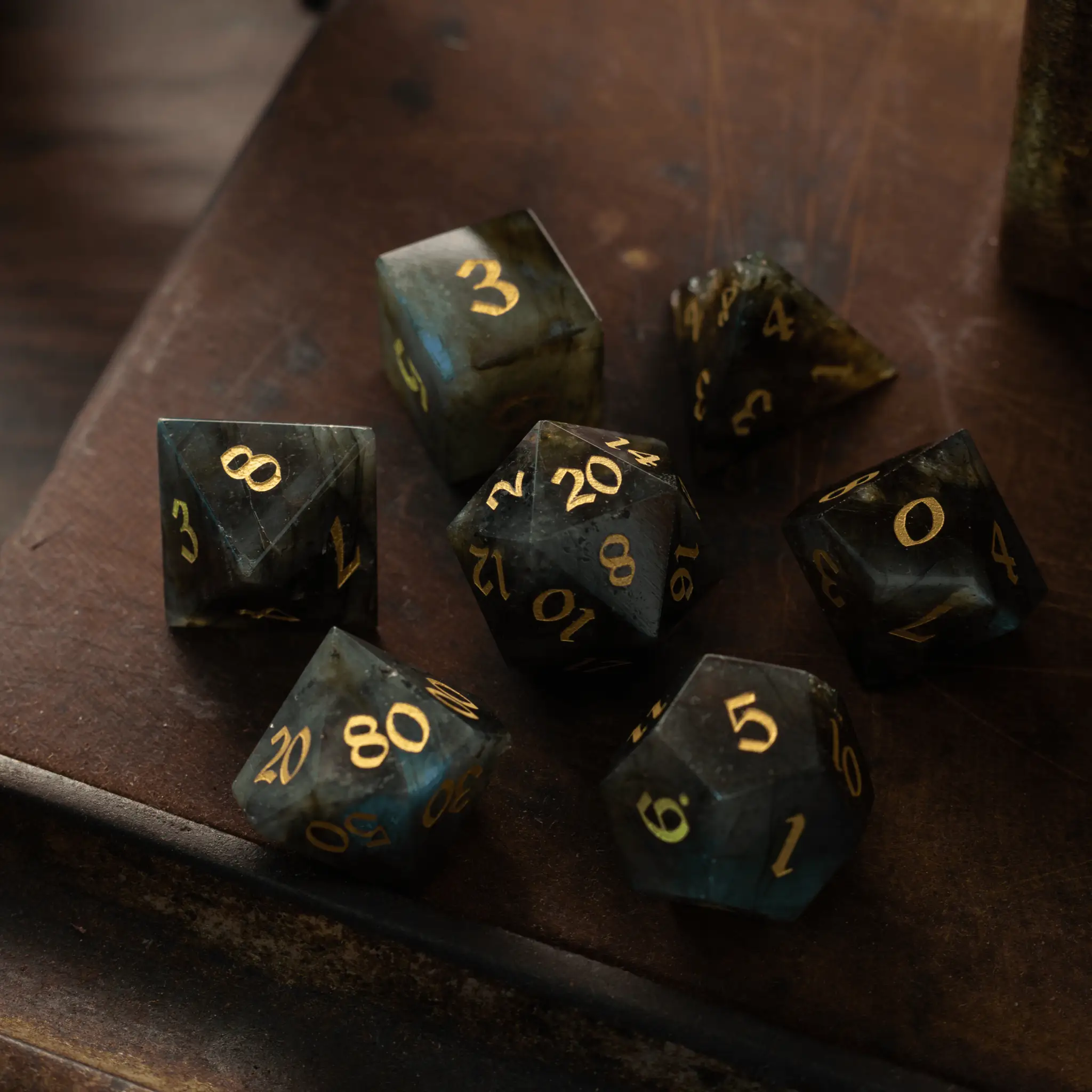 Labradorite gemstone DND dice set from Runic Dice, featuring colorful, polished gemstone polyhedral dice for tabletop gaming.