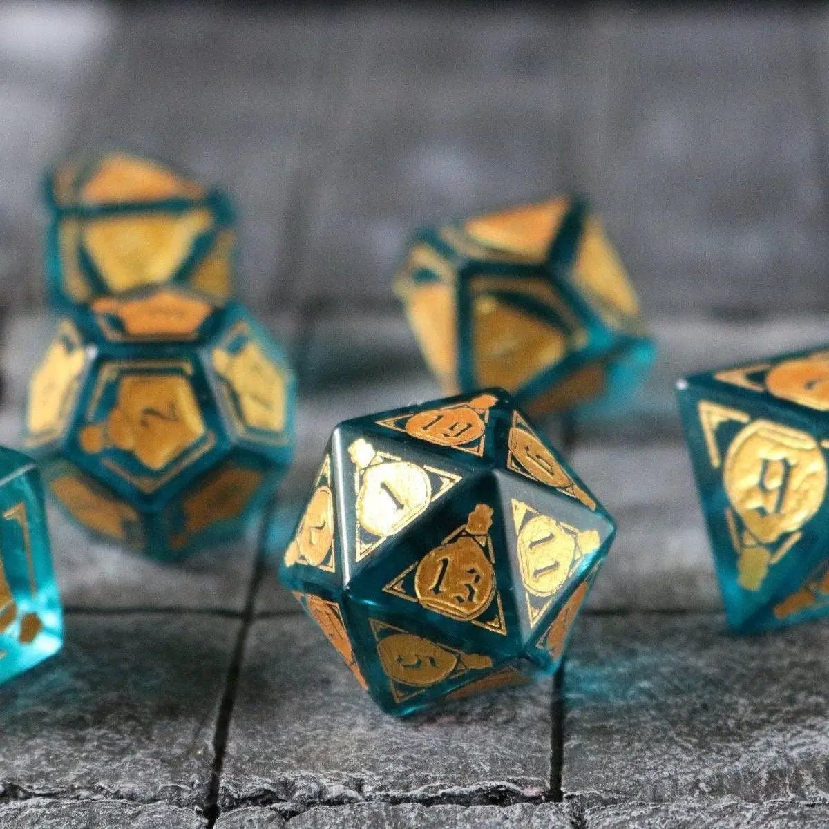 Blue zircon gemstone dice set by Runic Dice featuring mana potion-inspired DND dice with vibrant blue glass and intricate details.