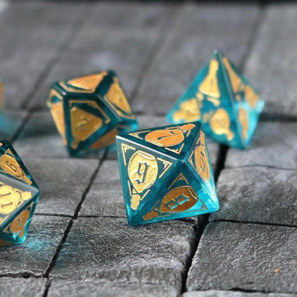 Blue zircon gemstone dice set by Runic Dice featuring a mana potion design for D&D gaming, with transparent glass and blue hues.