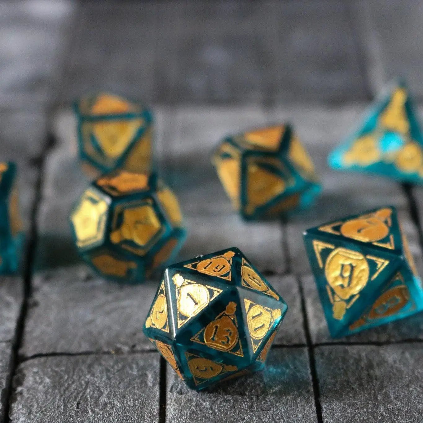Blue zircon gemstone DND dice set by Runic Dice featuring a mana potion design and transparent glass material.