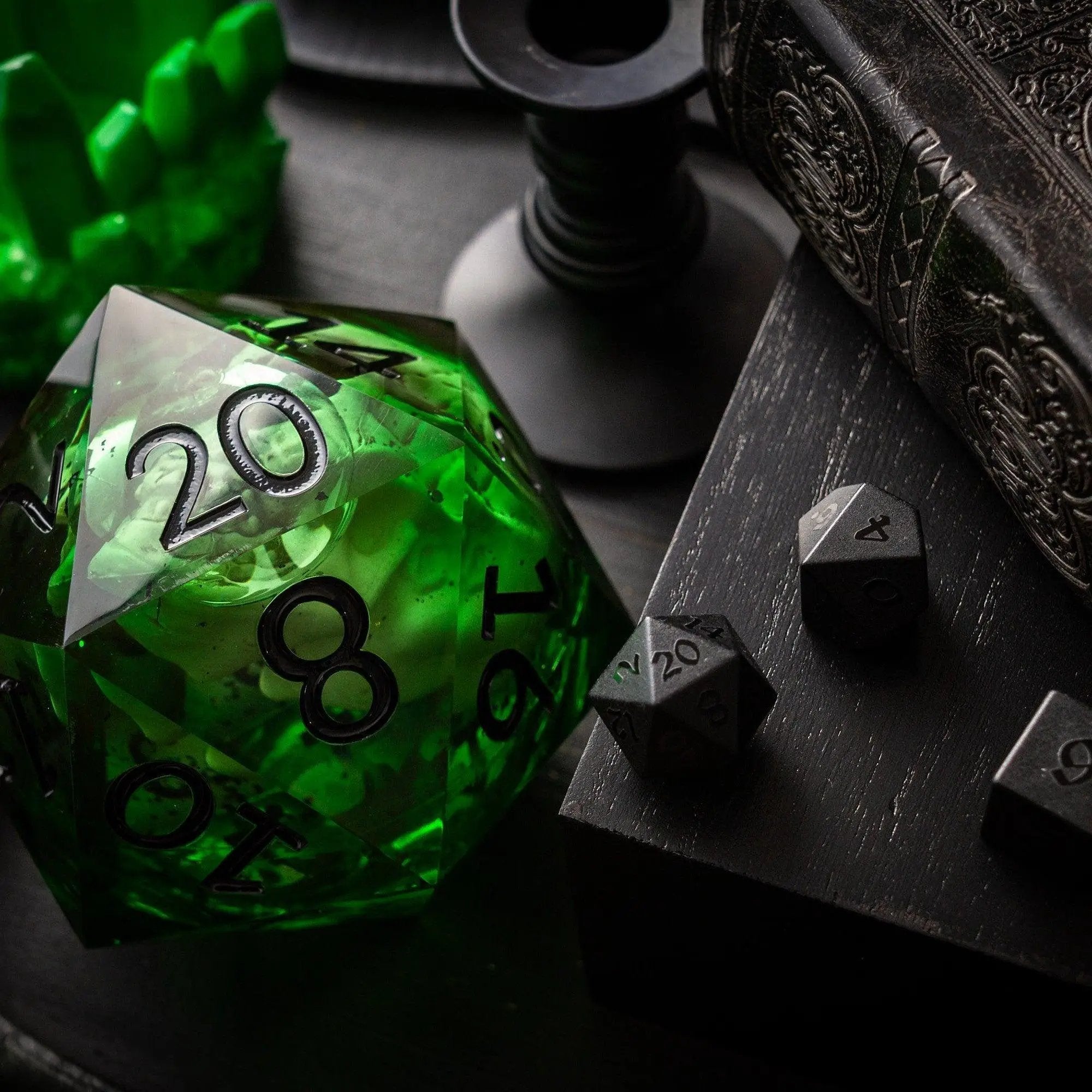 Green skull resin dice with liquid core and chonk size, handmade by Runic Dice, displayed with its box.