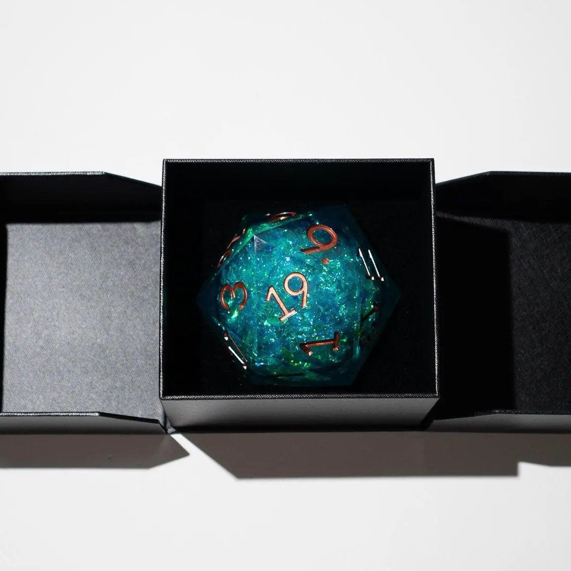 Sea green teal resin chonk dice with liquid core and matching box, handmade by Runic Dice, 95mm size, chunky and vibrant.