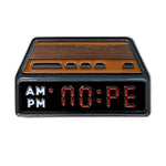 Kolorspun Nope Alarm Clock golf ball marker in black nickel, featuring a playful design with an alarm clock motif on a golf tee marker.