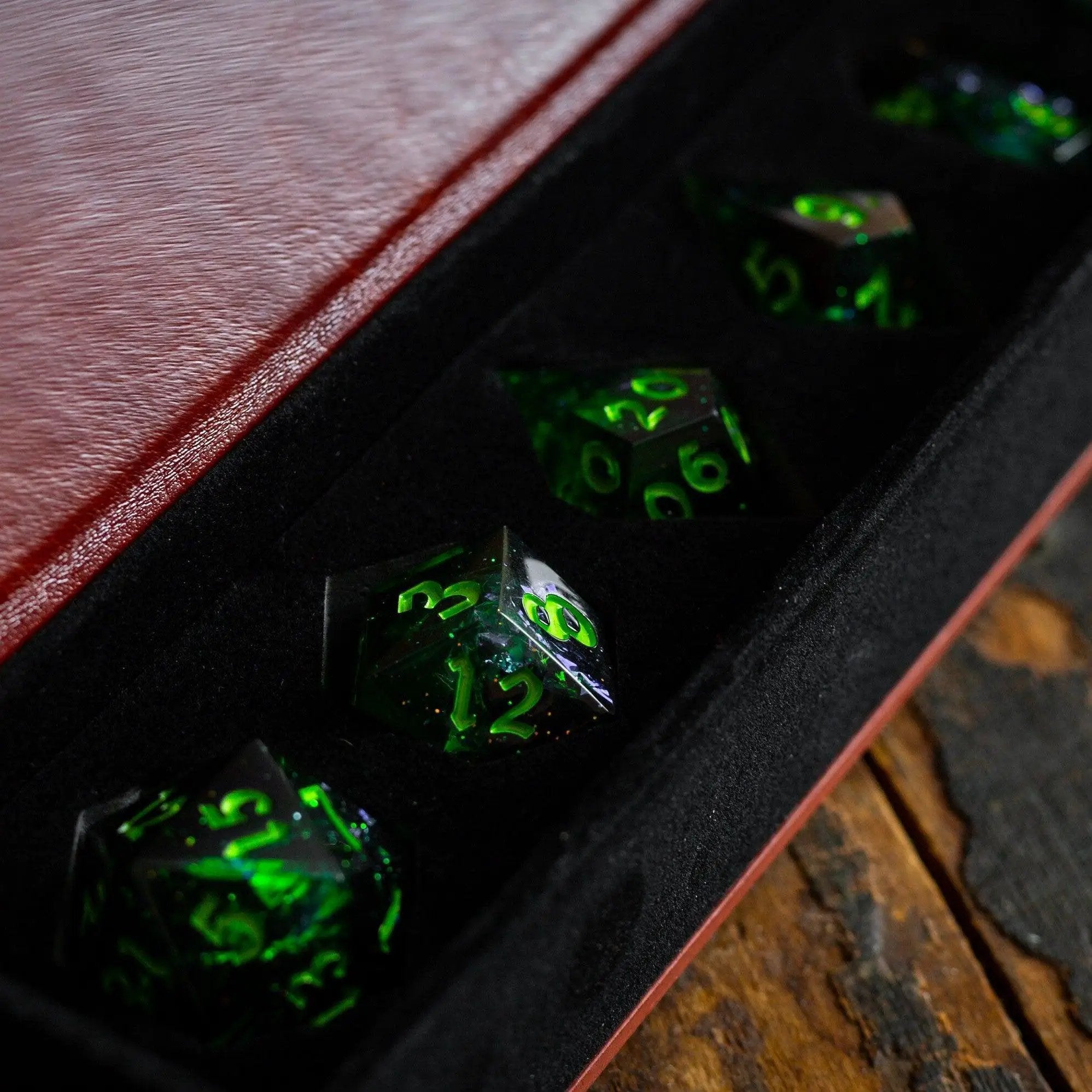 Nox Green handmade resin DND dice set by Runic Dice featuring six colorful, intricately designed polyhedral resin gaming dice.