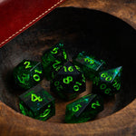 Nox Green handmade resin D&D dice set by Runic Dice, featuring vibrant green and black marbled design with numbered faces.