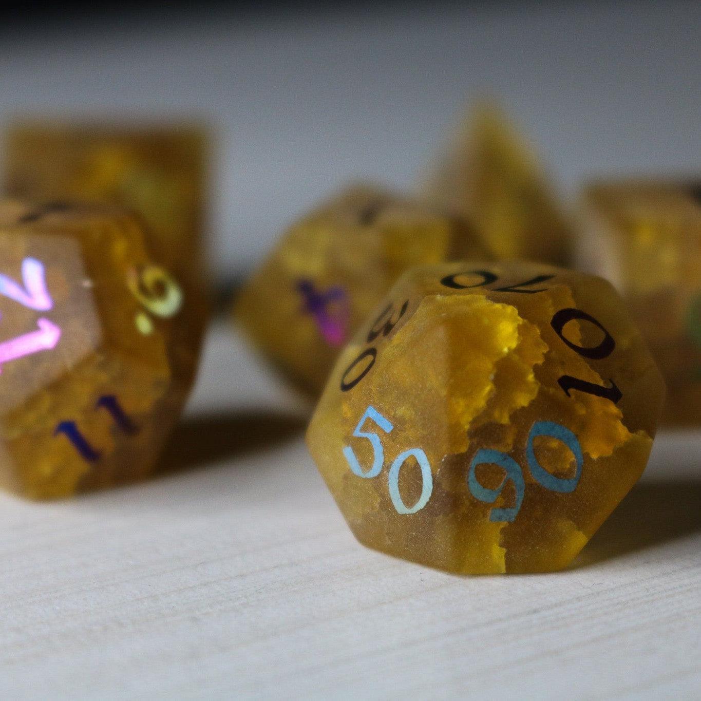 Orange Halloween pumpkin inked lightning cracked glass gemstone DND dice set by Runic Dice with spooky design.