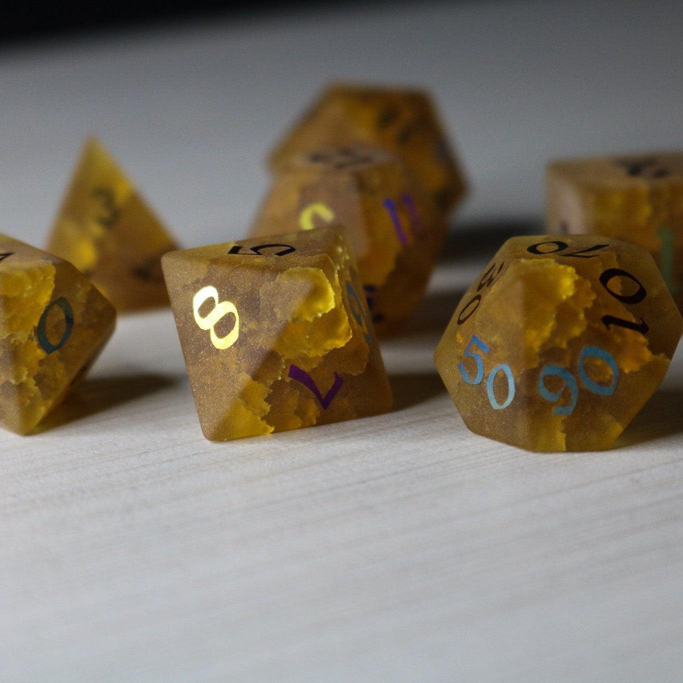 Orange Halloween pumpkin gemstone DND dice set with lightning-inked cracked glass design by Runic Dice.
