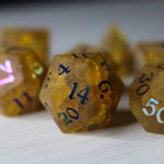 Orange Halloween pumpkin gemstone DND dice set with lightning-inked cracked glass design by Runic Dice.