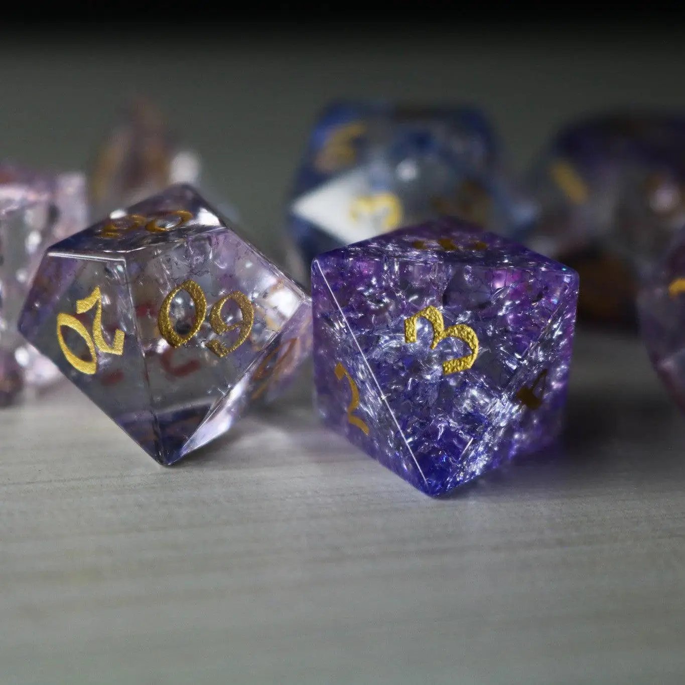 Runic Dice purple cloud forge fire glass gemstone DND dice set with vibrant, swirling purple and orange hues for tabletop gaming.