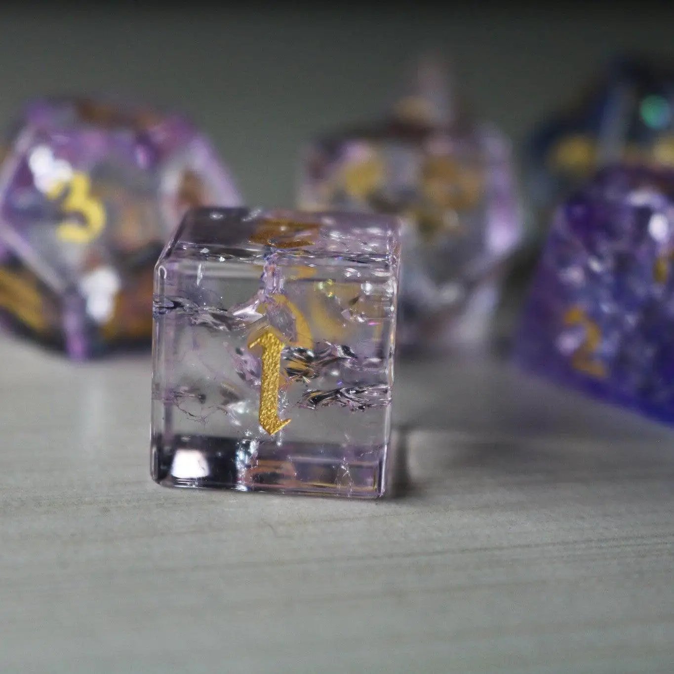 Purple gemstone D&D dice set featuring fire glass design by Runic Dice, includes six colorful, translucent polyhedral dice.