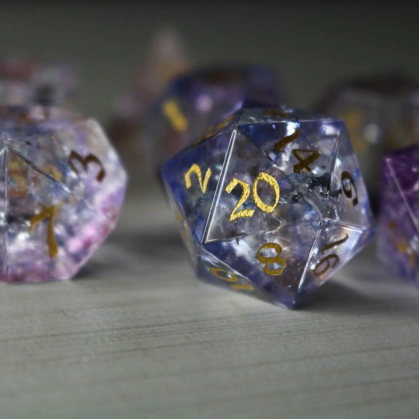 Purple gemstone DND dice set with fire glass design from Runic Dice, featuring purple cloud and forge-inspired details.