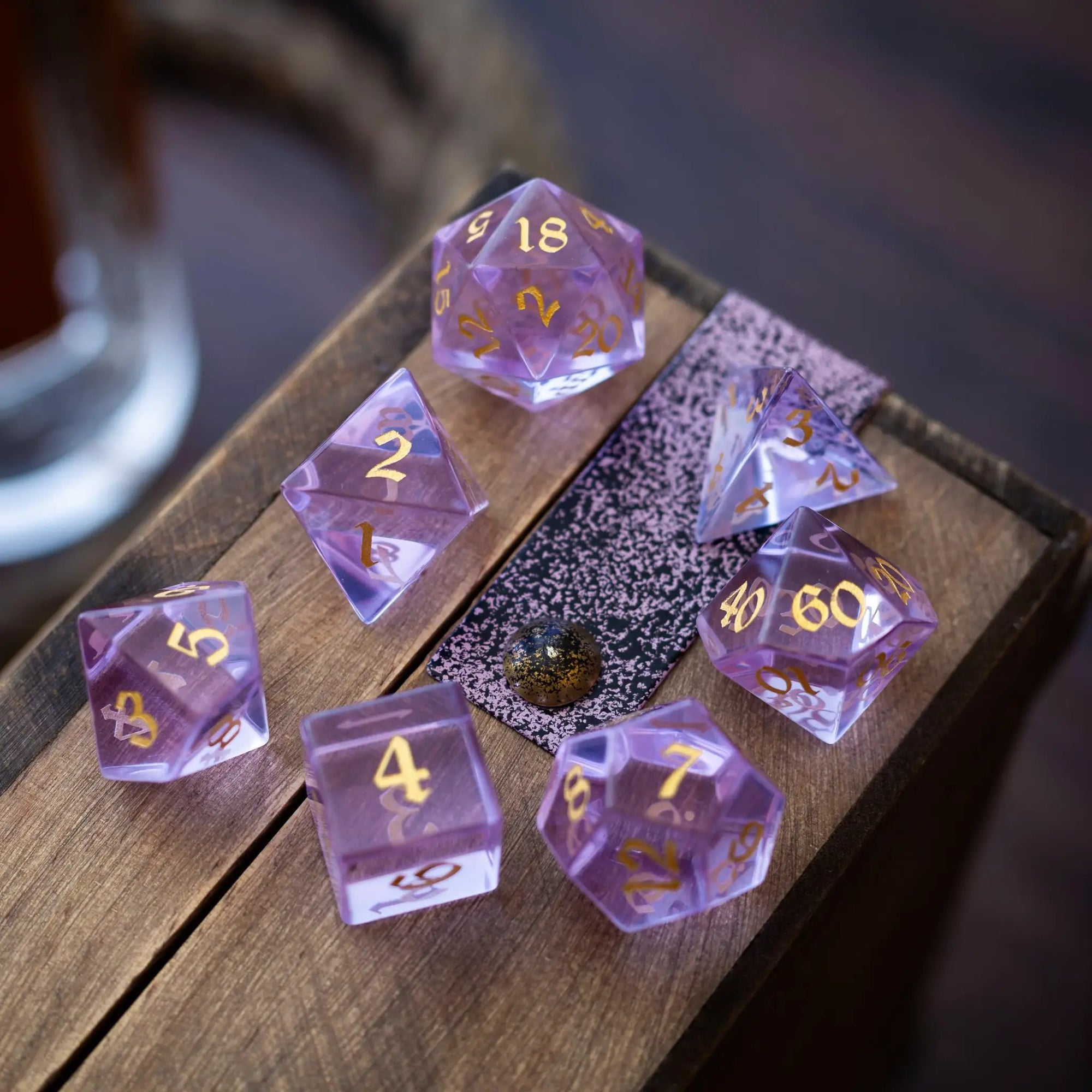 Purple zircon glass gemstone DND dice set with hand-carved designs by Runic Dice, featuring five intricately crafted gemstone dice.