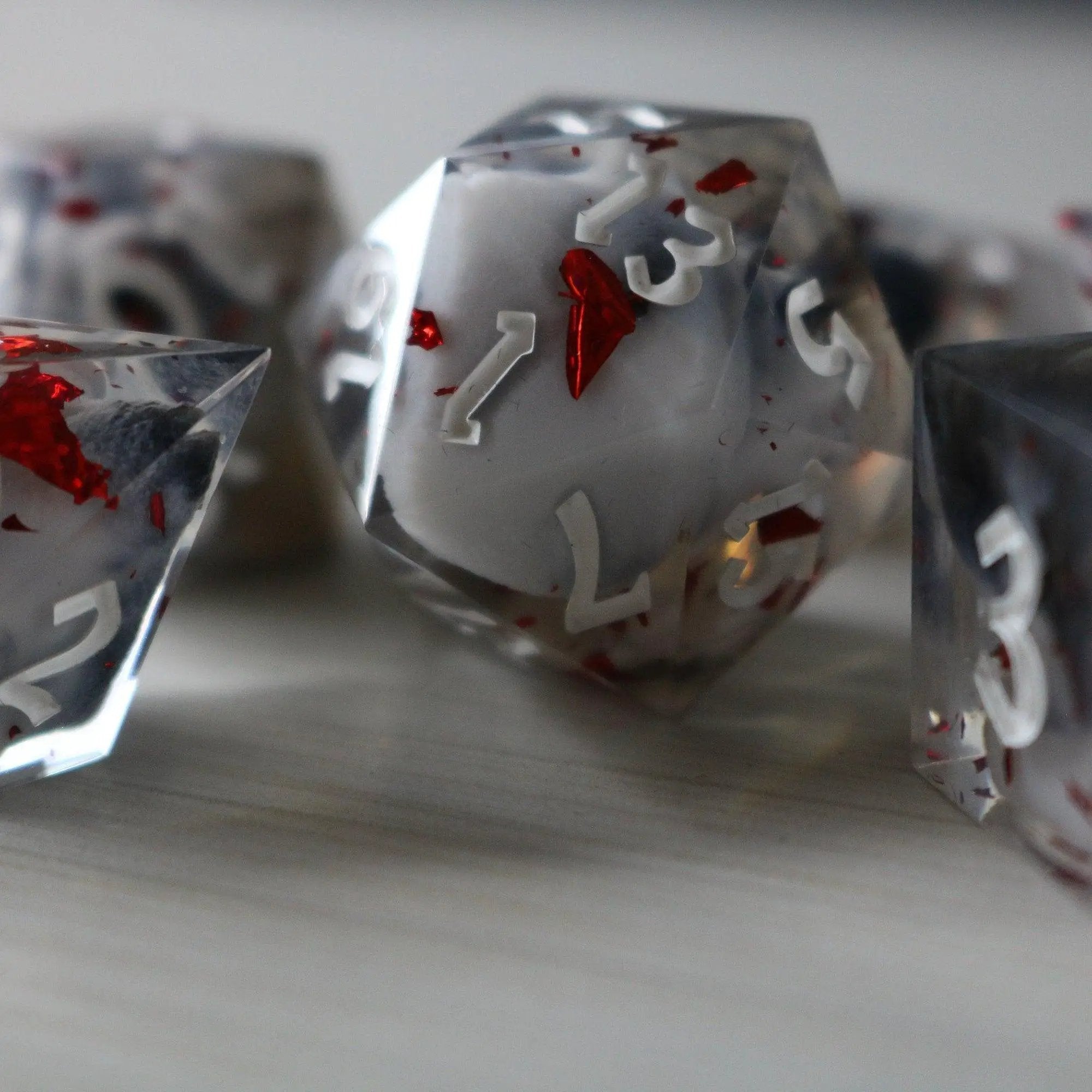 Smoke and Blood handmade resin DND dice set by Runic Dice, featuring dark, swirling smoke and blood-themed colorful resin.